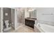 Bathroom with a shower, toilet and granite countertop at 9928 Ivory Dr, Ruskin, FL 33573