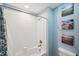 Clean bathroom with a bathtub and updated fixtures at 9928 Ivory Dr, Ruskin, FL 33573