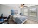 Serene bedroom with a work space and window coverings at 9928 Ivory Dr, Ruskin, FL 33573
