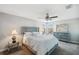 Comfortable bedroom with ceiling fan and plenty of space for storage at 9928 Ivory Dr, Ruskin, FL 33573