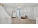 Light and airy Bedroom featuring animal art and a comfy rocking chair at 9928 Ivory Dr, Ruskin, FL 33573