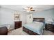 Spacious bedroom with a ceiling fan and dresser at 9928 Ivory Dr, Ruskin, FL 33573