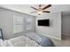 Bright bedroom featuring a ceiling fan and large windows at 9928 Ivory Dr, Ruskin, FL 33573