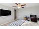 Bedroom with TV, work station, and large windows at 9928 Ivory Dr, Ruskin, FL 33573