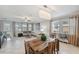 Open dining area with wooden table and a chandelier at 9928 Ivory Dr, Ruskin, FL 33573