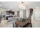 Dining room adjacent to kitchen with farmhouse table and staircase at 9928 Ivory Dr, Ruskin, FL 33573