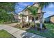 Two-story house with palm trees and manicured landscaping at 9928 Ivory Dr, Ruskin, FL 33573