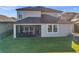 Two story house with screened patio and backyard at 9928 Ivory Dr, Ruskin, FL 33573