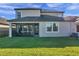 Two-story home with covered patio and fenced backyard at 9928 Ivory Dr, Ruskin, FL 33573