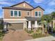 Two story house with brown siding and brick accents at 9928 Ivory Dr, Ruskin, FL 33573