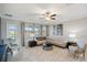 Living room with light and airy feel, comfortable seating, and access to backyard at 9928 Ivory Dr, Ruskin, FL 33573