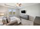 Main bedroom with spacious layout, ample closet space, and a TV at 9928 Ivory Dr, Ruskin, FL 33573