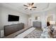 Main bedroom with a king-size bed and ensuite bathroom access at 9928 Ivory Dr, Ruskin, FL 33573