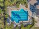 Overhead view of community pool with lap lanes and surrounding lounge chairs at 9928 Ivory Dr, Ruskin, FL 33573