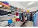 Large walk-in closet with ample shelving and hanging space at 9928 Ivory Dr, Ruskin, FL 33573