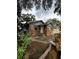 Ranch style home with stone facade and mature landscaping at 2011 Auburn S St, St Petersburg, FL 33712