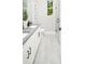 Modern bathroom boasts double vanity, a large shower, and grey tile floors at 12458 49Th E St, Parrish, FL 34219