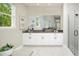 Modern bathroom with white vanity and large shower at 12458 49Th E St, Parrish, FL 34219