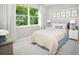 Guest bedroom with full bed and large window at 12458 49Th E St, Parrish, FL 34219