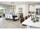 Bright dining area with large table and access to pool at 12458 49Th E St, Parrish, FL 34219