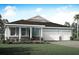 Two-story house with three-car garage and landscaped lawn at 12458 49Th E St, Parrish, FL 34219