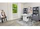 Bright home office features built-in shelving and a spacious work island at 12458 49Th E St, Parrish, FL 34219