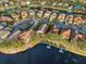 Aerial view of a waterfront community with houses at 18052 Java Isle Dr, Tampa, FL 33647
