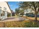 Spacious backyard with pavers patio overlooking the lake at 18052 Java Isle Dr, Tampa, FL 33647