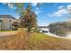 Lakefront backyard with a dock and lush landscaping at 18052 Java Isle Dr, Tampa, FL 33647