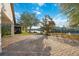 Large backyard patio with lake view in sunny weather at 18052 Java Isle Dr, Tampa, FL 33647