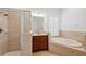 Bathroom features a soaking tub, shower and single vanity at 18052 Java Isle Dr, Tampa, FL 33647