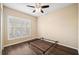 Bright bedroom with wood floors and a ceiling fan at 18052 Java Isle Dr, Tampa, FL 33647