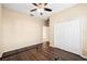 Bedroom with double door closet and wood flooring at 18052 Java Isle Dr, Tampa, FL 33647