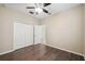 Well lit bedroom with ceiling fan and double door closet at 18052 Java Isle Dr, Tampa, FL 33647