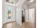 Elegant entryway showcasing tile floors and access to other rooms at 18052 Java Isle Dr, Tampa, FL 33647