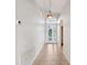 Light and airy entryway with tile floors and a charming glass front door at 18052 Java Isle Dr, Tampa, FL 33647