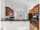 Kitchen with wood cabinets, granite countertops, and stainless steel appliances at 18052 Java Isle Dr, Tampa, FL 33647