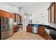 Updated kitchen with wood cabinets, granite countertops, and stainless steel appliances at 18052 Java Isle Dr, Tampa, FL 33647
