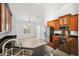 Modern kitchen featuring wood cabinets, granite countertops, and stainless steel appliances at 18052 Java Isle Dr, Tampa, FL 33647