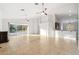 Open living room featuring tile flooring and access to the backyard at 18052 Java Isle Dr, Tampa, FL 33647