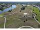Aerial view of the community, highlighting the golf course and lake at 2407 Locksley St # 224, Sun City Center, FL 33573
