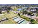 Aerial view of community with lake, tennis courts, and shuffleboard at 2407 Locksley St # 224, Sun City Center, FL 33573