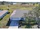Single story home with attached garage and paved driveway at 2407 Locksley St # 224, Sun City Center, FL 33573