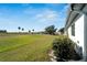 Backyard with lush grass, offering a view of a golf course at 2407 Locksley St # 224, Sun City Center, FL 33573
