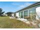 Backyard view of home, showing patio and lush landscaping at 2407 Locksley St # 224, Sun City Center, FL 33573