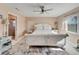 Serene bedroom with king-size bed and access to a bathroom at 2407 Locksley St # 224, Sun City Center, FL 33573