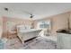Relaxing bedroom with a king-size bed and en-suite bathroom at 2407 Locksley St # 224, Sun City Center, FL 33573