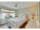Bright bedroom with a queen bed and window at 2407 Locksley St # 224, Sun City Center, FL 33573