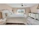 Spacious bedroom with large bed, dresser, and window at 2407 Locksley St # 224, Sun City Center, FL 33573