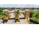 Gated community entrance with arched entryway and landscaping at 2407 Locksley St # 224, Sun City Center, FL 33573